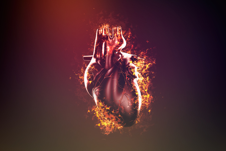 Abstract human heart in flame and smoke